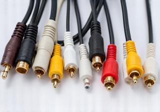Various audio and video cables neatly arranged